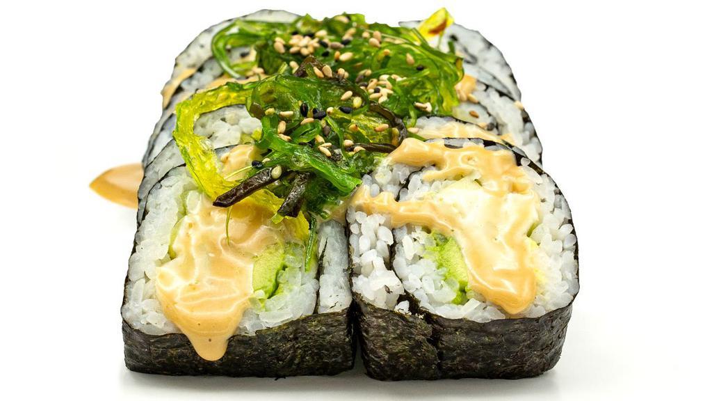 Swamp Thing Roll · Avocado and cucumber topped with seaweed salad, sesame seeds, & sesame sauce.