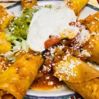 Taquitos · Your choice of shredded beef or chicken, served with jack cheese, guacamole, sour cream and ...