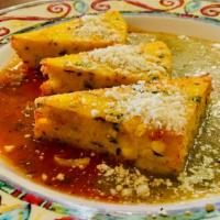 Baja Style Polenta · Grilled with corn, green chilies, smoked mozzarella cheese, served with mild red and green s...