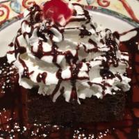 Sour Cream Fudge Cake · Incredibly moist chocolate fudge cake infused with a hint of sour cream, served warm, a la m...