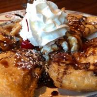 Sopapillas · Deep fried puff pastry, dusted with cinnamon sugar, drizzled with caramel sauce, served with...