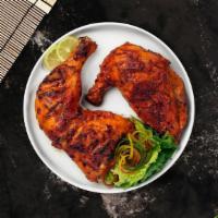 Tandoori Chicken · Tandoori chicken cooked in a clay oven with charcoal (bone-in).