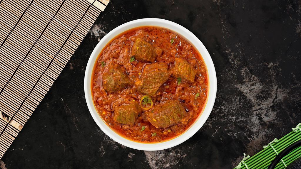 Lamb Bhunna · Lamb cooked in hot spicy curry infused with onions and tomatoes.