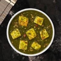 Saag Paneer · Cubes of fresh homemade cheese cooked in a spinach gravy infused with garlic, ginger, and sp...