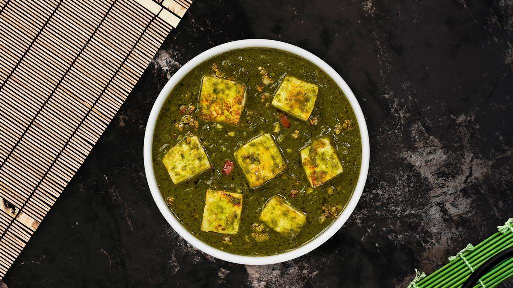 Saag Paneer · Cubes of fresh homemade cheese cooked in a spinach gravy infused with garlic, ginger, and spices.