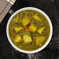 Aloo Saag · Idaho potato cubes cooked in a spinach gravy infused with garlic, ginger & fresh spices.