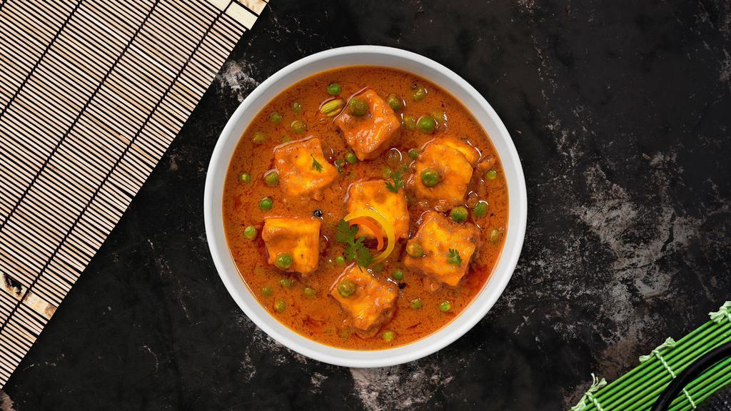 Matar Paneer · Green peas cooked with cheese in a creamy tomato sauce.