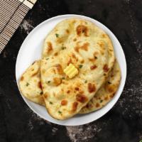 Cheese Naan · Freshly baked bread stuffed with cheese.