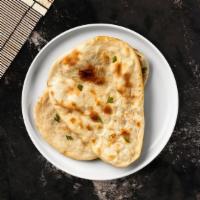 Onion Naan · Freshly baked bread stuffed with onions and fresh cilantro.