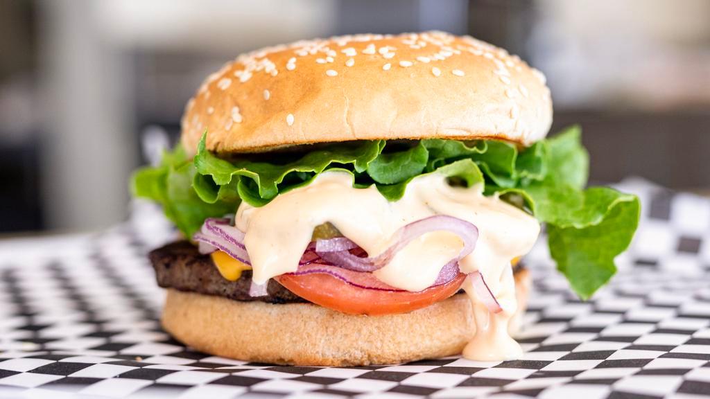 1. The Rock · Beef patty, cheese, lettuce, tomatoes, onion, pickles and house sauce.

These items are served raw or undercooked, or contain or may contain raw or undercooked ingredients.