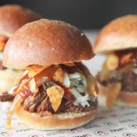 Brisket Sliders · Pulled pork, caramelized onions, pepper jack cheese and sweet bbq sauce on three brioche buns.