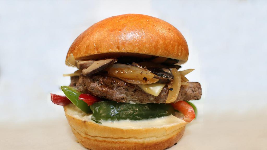 IMPOSSIBLE Philly Me Baga · Eat the IMPOSSIBLE with the 100% plant based IMPOSSIBLE Burger. Topped with umami glaze, caramelized onions, cheddar, Umai teriyaki, kimchi relish, string frits, on a brioche bun.