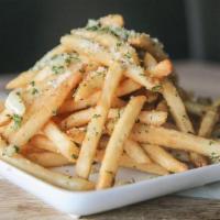 Garlic Fries · Crispy fries loaded with garlic, garlic, garlic, oh and parmesan cheese!