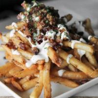 Bacon Ranch Fries · Crispy fries topped with bacon, house ranch dressing and parsley flakes.