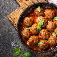 Meatballs with Marinara · Three juicy meatballs drenched house made marinara sauce.