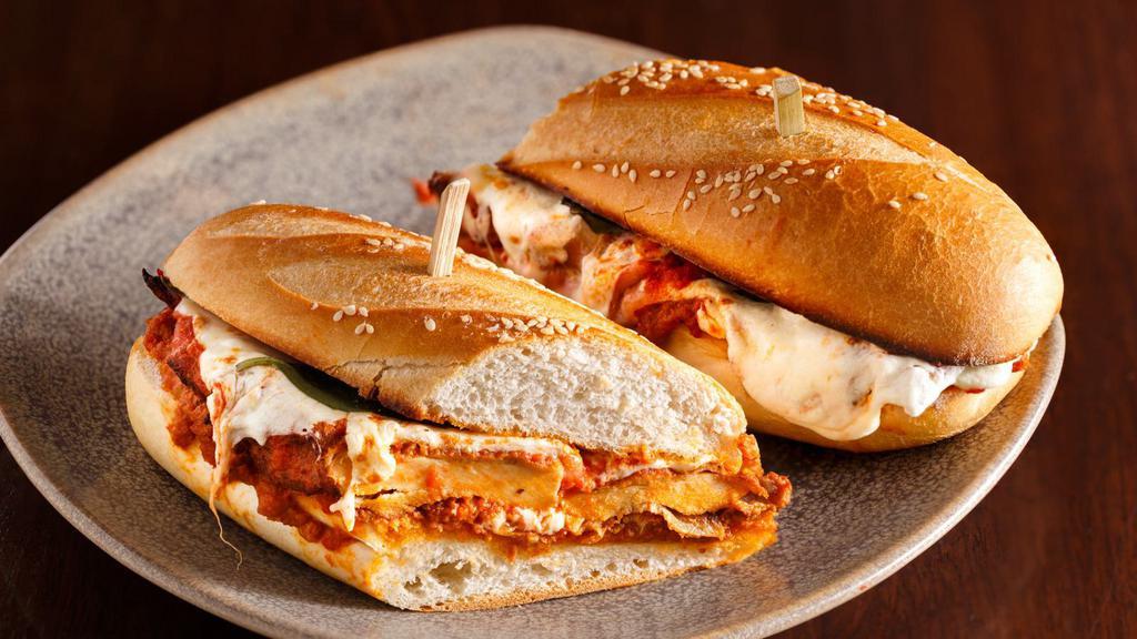 Chicken Parmigiana Sandwich · White meat chicken, house-made marinara sauce, and parmesan cheese stuffed in between fresh made bread.
