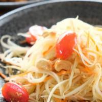 Som Tum · Shredded green papaya and carrot, garlic, cherry tomatoes, chili toasted cashew nuts tossed ...