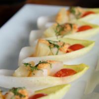 Scallops in the Boat · Grilled scallops and pineapple wrapped in Belgian endive leaves with special sauce garnished...