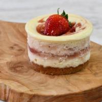 Strawberry Fields Cheesecake · Creamy vanilla filling with house-made organic strawberry purée of fresh organic California ...