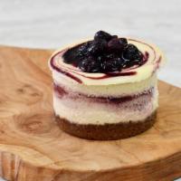 Beet & Berry Cheesecake · Our signature cheesecake — a creamy filling with delicious swirls of a fruit purée reduction...