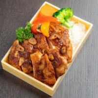 Garlic Chicken Teriyaki · Chicken teriyaki cooked with savory garlic glaze served with rice and vegetables