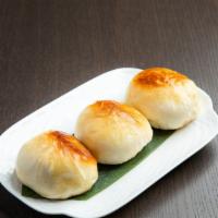 Shanghai Pan Fried Bun · Shanghai style bun with pork and cabbage fried to perfection on the bottom
