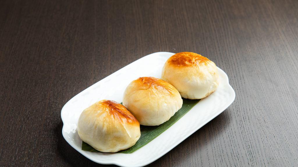 Shanghai Pan Fried Bun · Shanghai style bun with pork and cabbage fried to perfection on the bottom