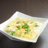 Egg Drop Soup · Chicken broth soup with egg, carrots, and green onion