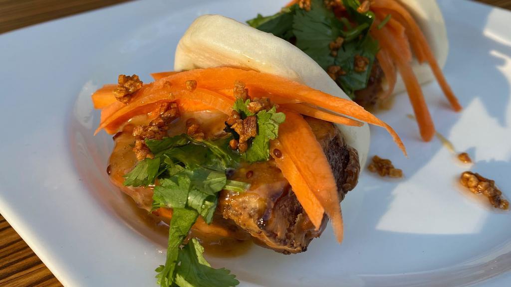 3. Steamed Buns, Pork Belly, Duck, Chicken, Tofu · Choice pork, chicken, tofu, or duck. Steamed soft buns filled with crispy melt in your mouth pork belly or chicken or tofu, sweet and sour carrot pickles, mustard chili sauce and crispy garlic