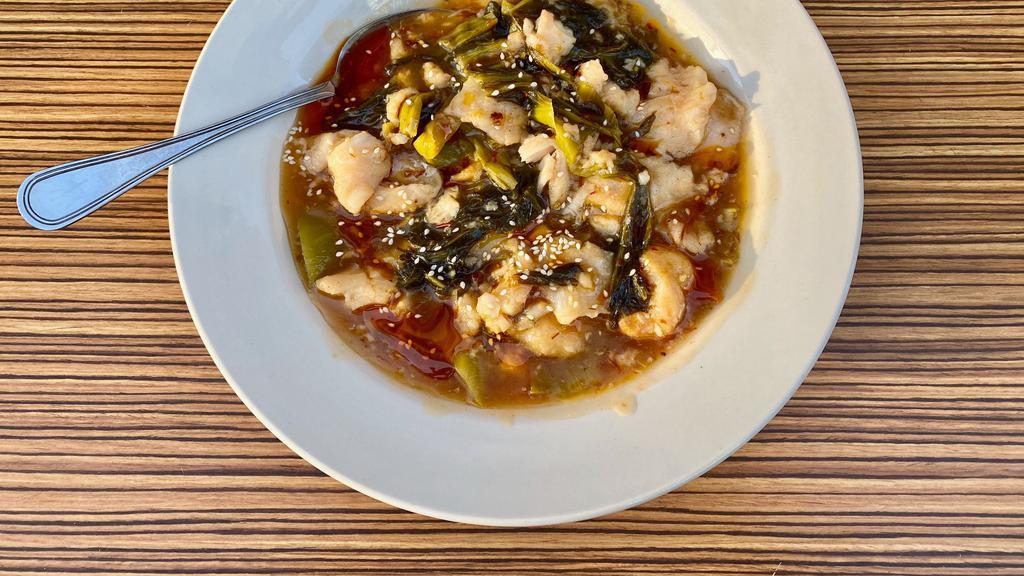 5. Pickled Mustard Green Fish Filet Over Rice · Tender velvety fish filet simmered in a wok with pickled sour mustard greens and chili oil, resulting in a umami bursting sauce with a hint of citrus from the mustard greens.