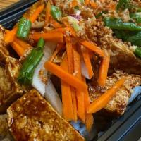12. Southeast Asian Tofu Bowl · Crispy tofu tossed in a sweet chili plum sauce topped with pickled sweet and sour carrots, f...