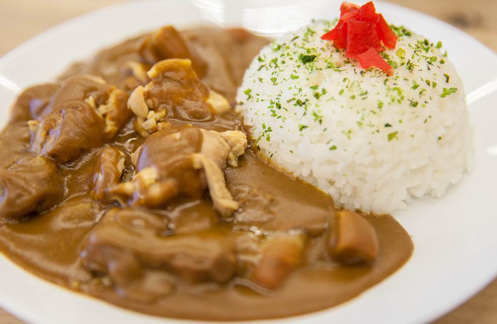 Curry Chicken Over Rice · Tender chicken, carrots, onion, potato in rich curry sauce over Rice.