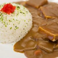 Vegetarian Curry Over Rice · Tofu, carrots, onion, potato in rich curry sauce over Rice.