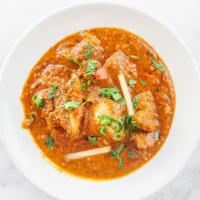 28. Chicken Curry · Boneless chicken cooked to perfection with fresh ginger, garlic, tomatoes, and spices.