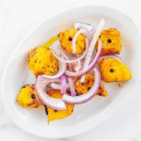 41. Chicken Tikka Kabab · Boneless chicken breast marinated in yogurt, spices, and grilled in tandoor.