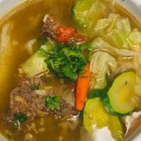 Beef Soup/Caldo de Res · With Beef Rib, Yucca, corn,carrots, zucchini,  and cabbage