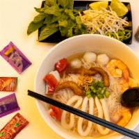 9. Hủ Tíu  & Mì Hải Sản · Seafood combination. Shrimp, squid, fish ball, fried fish slices and imitation crabs.