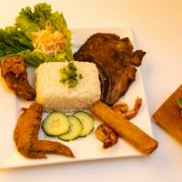 17. Cơm Đặc Biệt · Special Combo Plate: Grilled Pork Chop, Shrimps, Fried Chiken Wings & Imperial Roll over Rice.