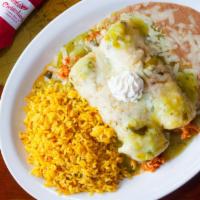 Enchiladas Suizas · (Beef or Chicken) Coming down the track, this meal leads the group. Two corn tortillas rolle...