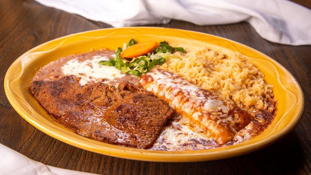 La Favorita · A deliciously seasoned thin Steak served with a Cheese Enchilada
Served with Rice and Beans