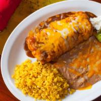 36. Chimichanga · Crispy flour tortilla filled with your choice of:
Beef, Chicken or Chile Verde
Topped with G...