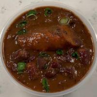Side of Red Beans & Rice · New orleans red beans and rice cooked low and slow with ham hocks, topped with grilled andou...