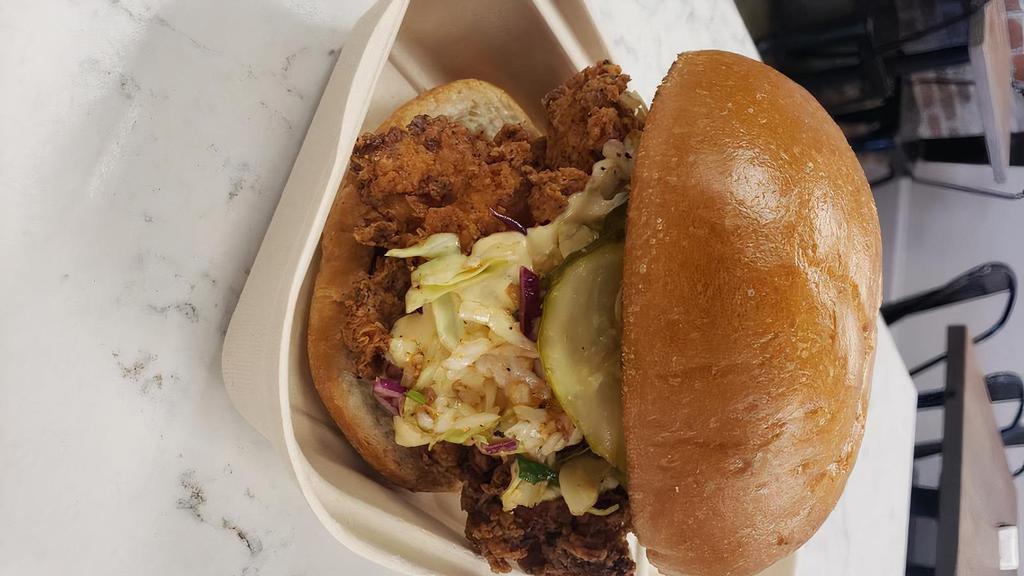 Southern Fried Chicken Sandwich · Marinated chicken breast fried to perfection and served on a french bun dressed with our vinaigrette slaw and housemade Old Bay garlic aioli.