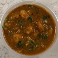 Seafood Gumbo · A seafood stew with gulf shrimp, pacific cod, and rock crab. Served with a mound of white ri...
