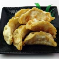 Chicken Gyoza · Japanese style chicken potstickers, fried. Comes with dipping sauce. 6 pieces.