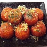 Takoyaki · Fried octopus balls, nori, bonito flake, takoyaki sauce. 8 pieces.