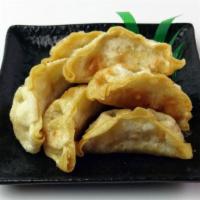 Veggie Gyoza · Japanese style veggie potstickers, fried. Comes with dipping sauce. 6 pieces. (v)