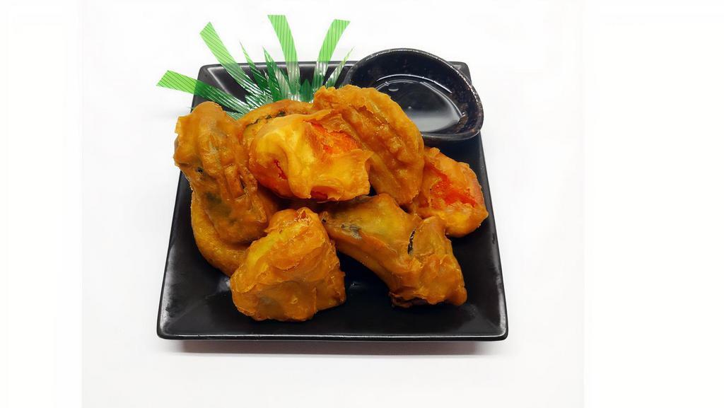 Veggie Tempura · Kabocha squash, Japanese yam, taro, lotus root, seasonal vegetables. Comes with tempura sauce, 6 pieces. (v)