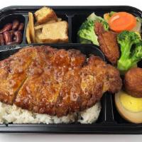 Fried Pork Loin · Center cut pork loin, lightly fried, and glazed with our house railroad sauce.