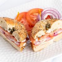 Lox Sandwich · Bagels with plain cream cheese, lox sliced, tomato, onion and capers.
